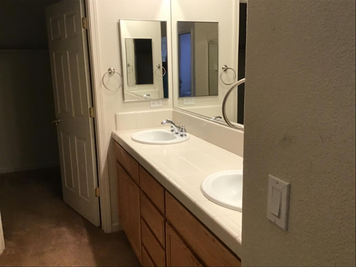 205 Quail Meadow Lane Copperopolis, CA 95228 - Photo 25 of 27 a bathroom with a sink and a mirror