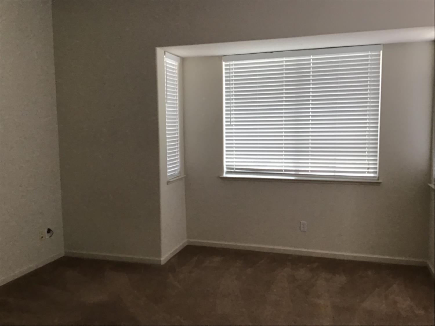 205 Quail Meadow Lane Copperopolis, CA 95228 - Photo 26 of 27 an empty room with a window