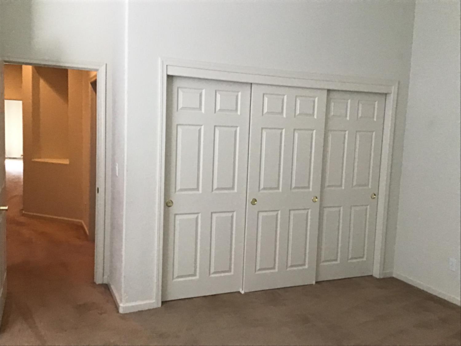 205 Quail Meadow Lane Copperopolis, CA 95228 - Photo 27 of 27 an empty room with windows