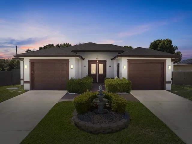 a front view of a house with garden
