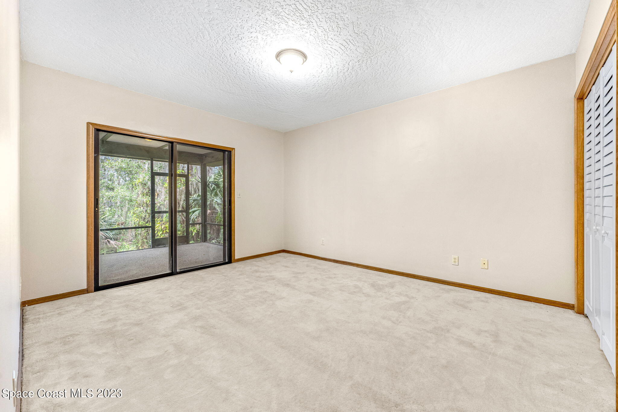 3700 Shady Run Road Melbourne, FL 32934 - Photo 15 of 27 a view of an empty room with a window