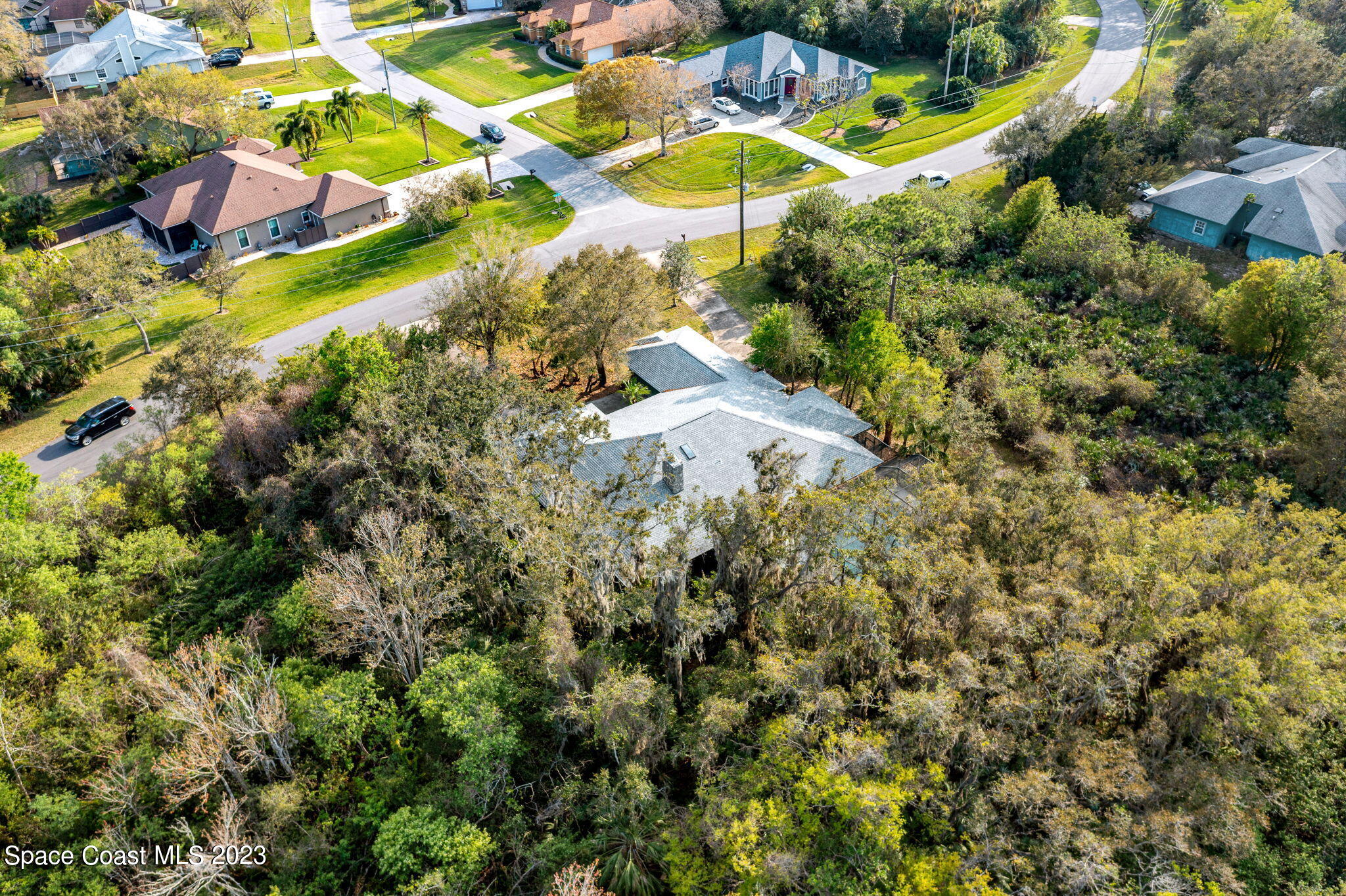 3700 Shady Run Road Melbourne, FL 32934 - Photo 21 of 27 an aerial view of residential houses with outdoor space and trees