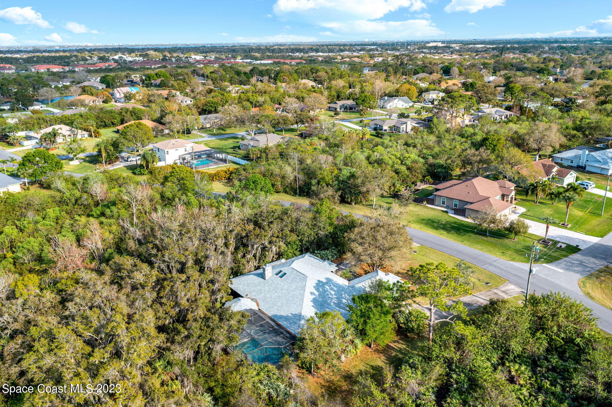 3700 Shady Run Road Melbourne, FL 32934 - Photo 22 of 27 an aerial view of residential houses with outdoor space and trees