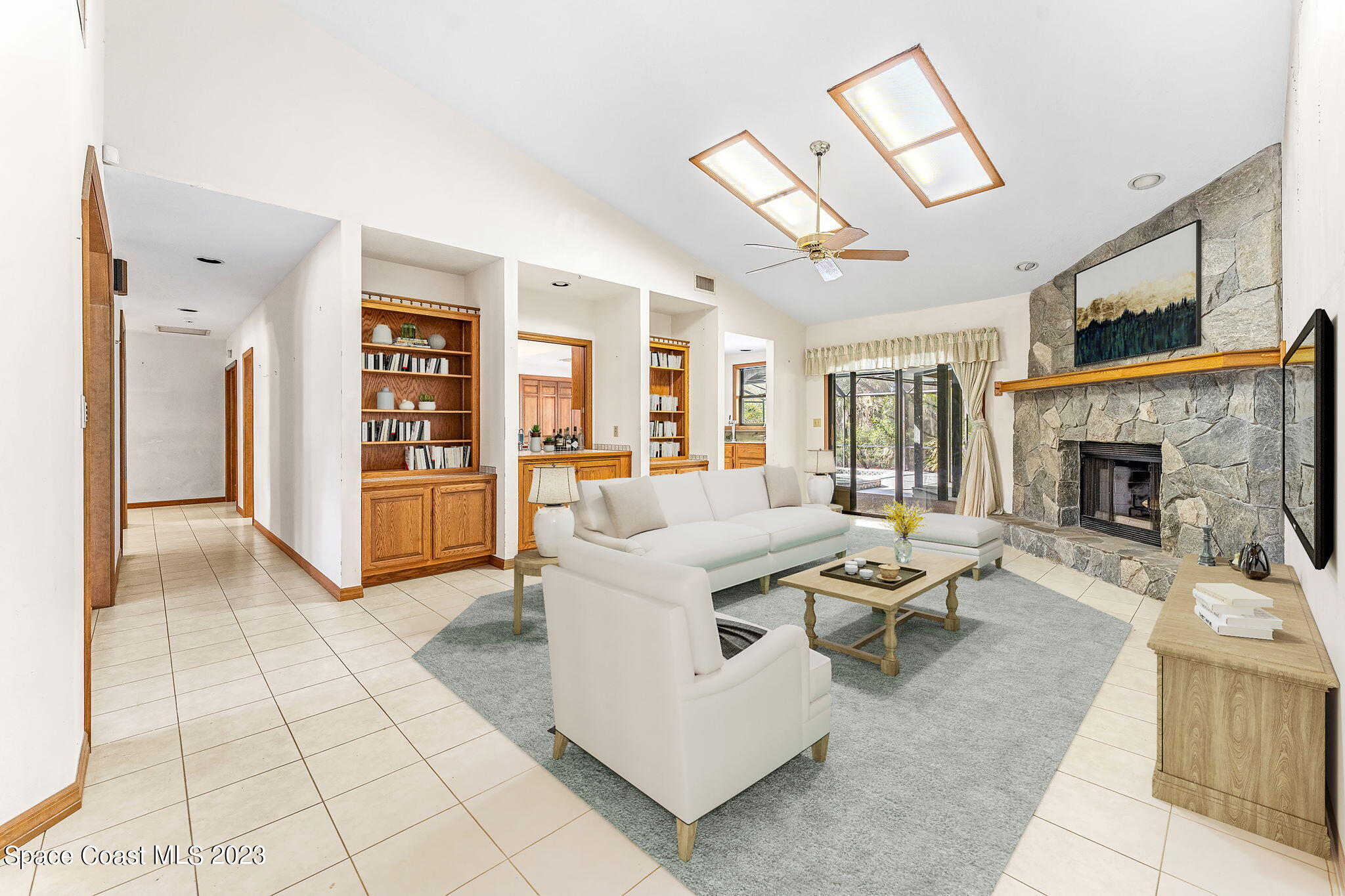 3700 Shady Run Road Melbourne, FL 32934 - Photo 5 of 27 a living room with furniture and a fireplace
