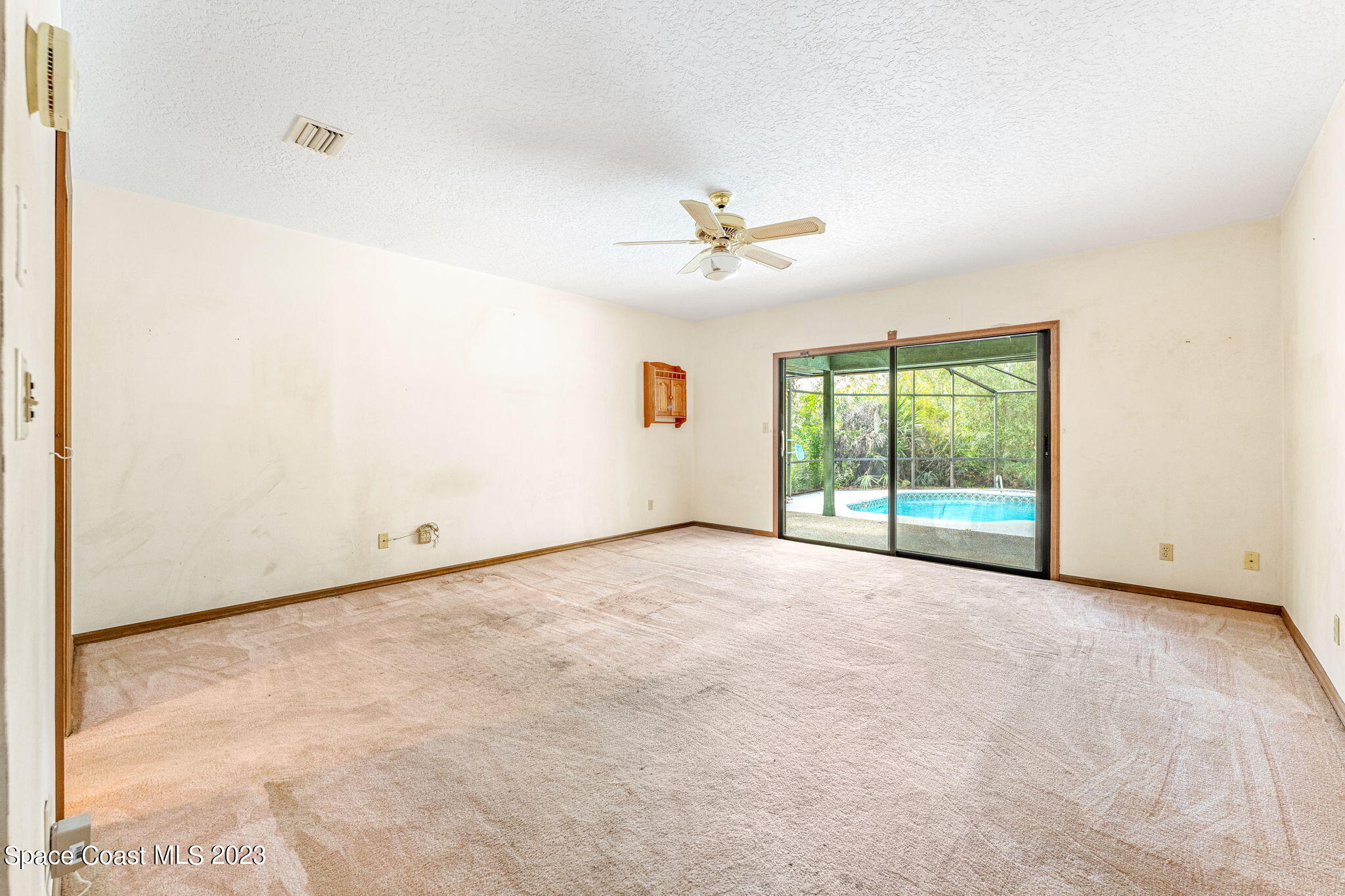 3700 Shady Run Road Melbourne, FL 32934 - Photo 9 of 27 a view of an empty room with a window