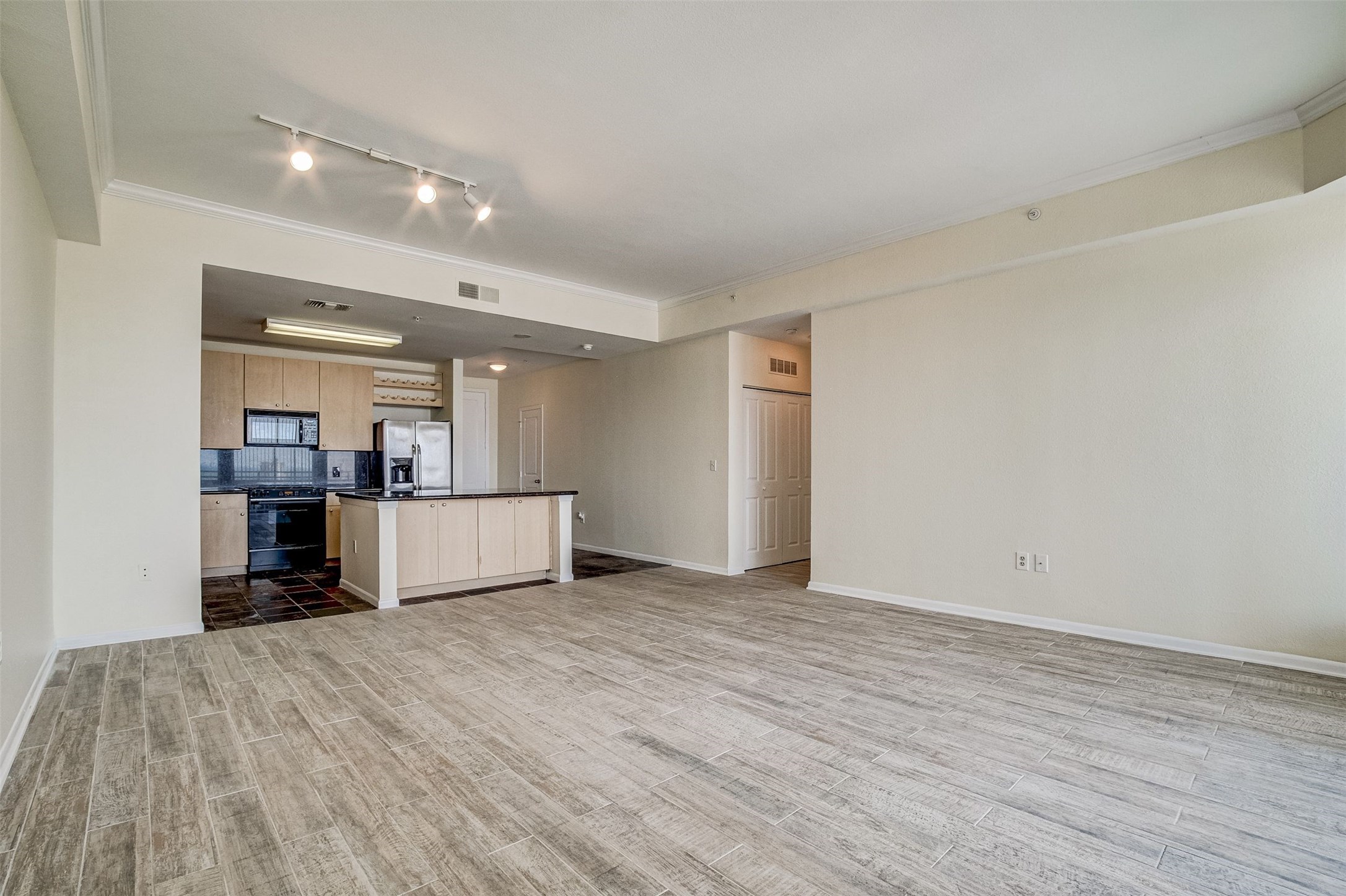 3505 Sage Road, Unit 2403 Houston, TX 77056 - Photo 14 of 26 a view of empty room with wooden floor