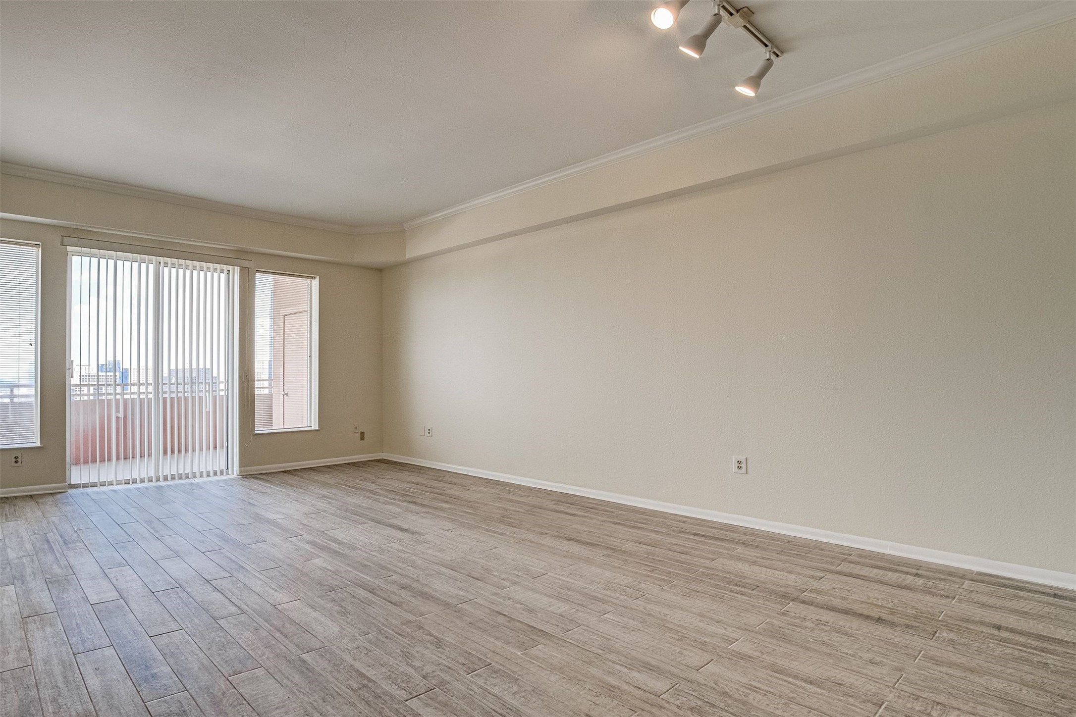 3505 Sage Road, Unit 2403 Houston, TX 77056 - Photo 15 of 26 wooden floor in an empty room with a window