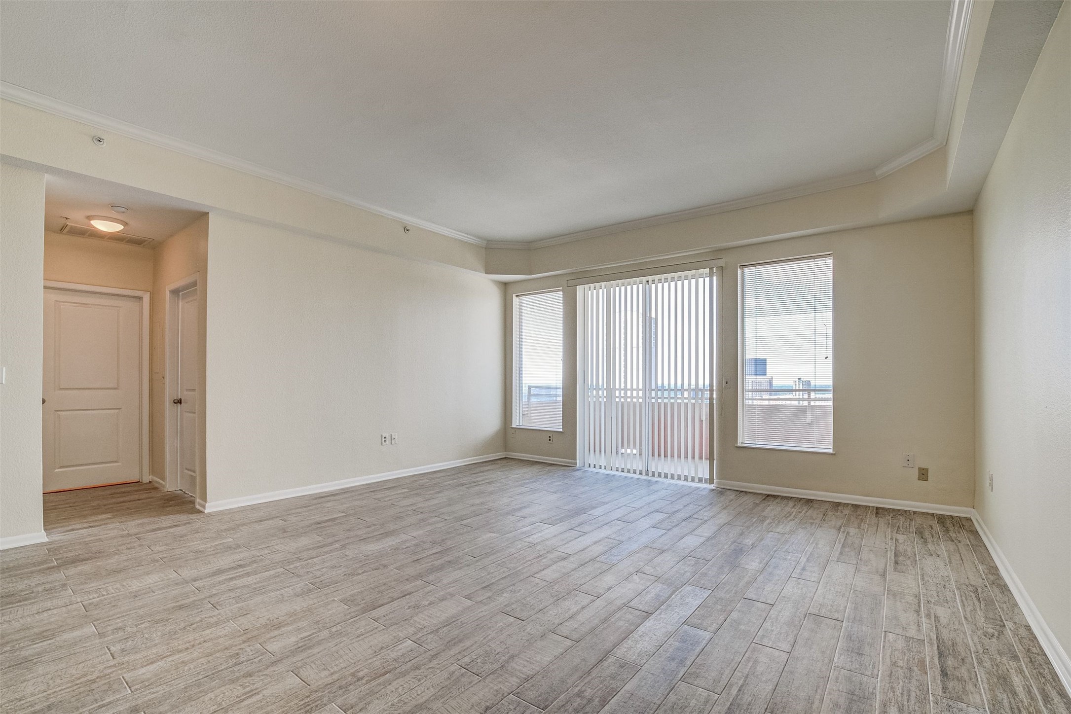 3505 Sage Road, Unit 2403 Houston, TX 77056 - Photo 16 of 26 a view of an empty room with wooden floor and window