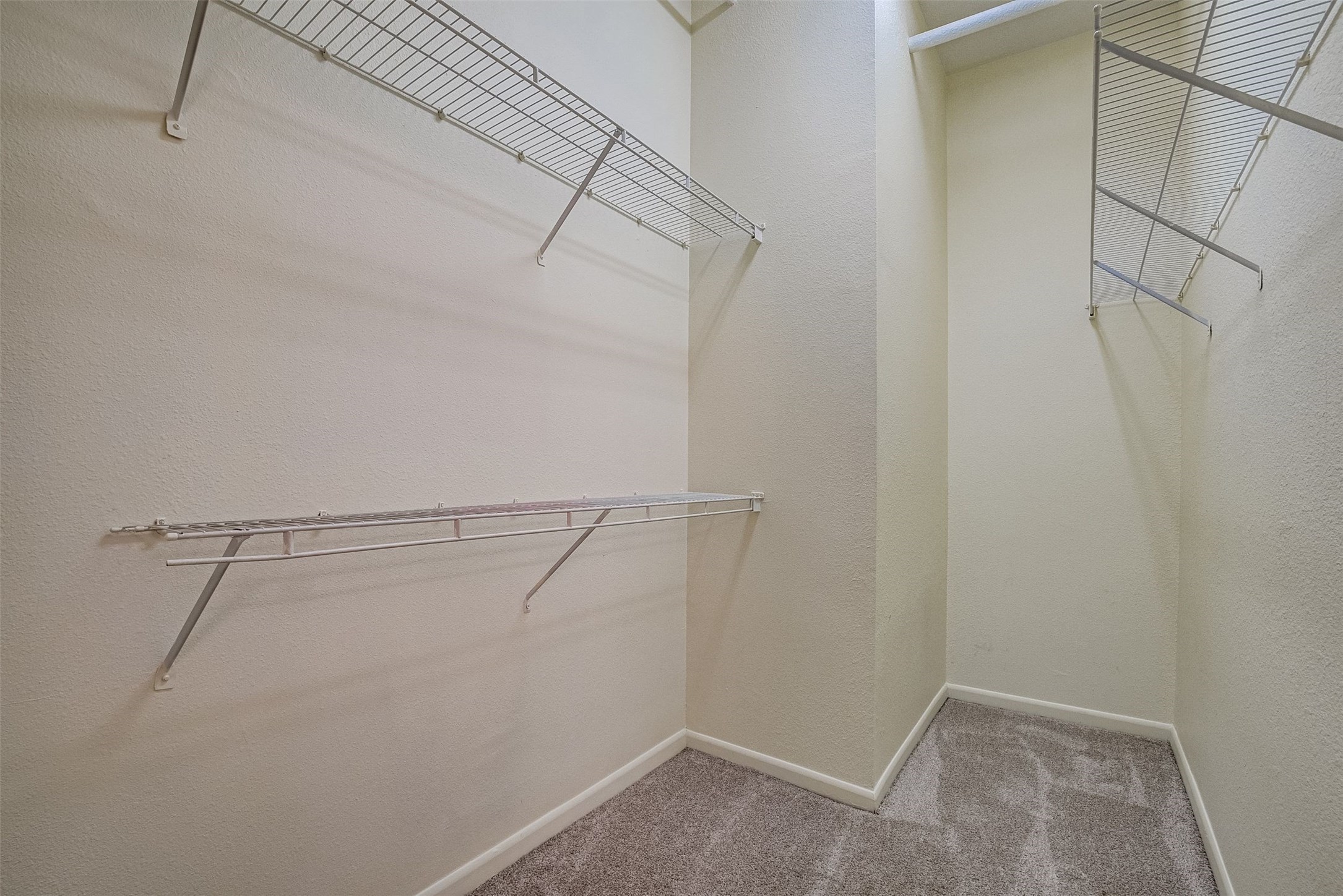 3505 Sage Road, Unit 2403 Houston, TX 77056 - Photo 23 of 26 a view of a room with racks on the wall