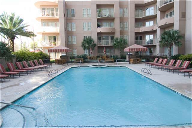 3505 Sage Road, Unit 2403 Houston, TX 77056 - Photo 4 of 26 a view of a swimming pool with outdoor seating