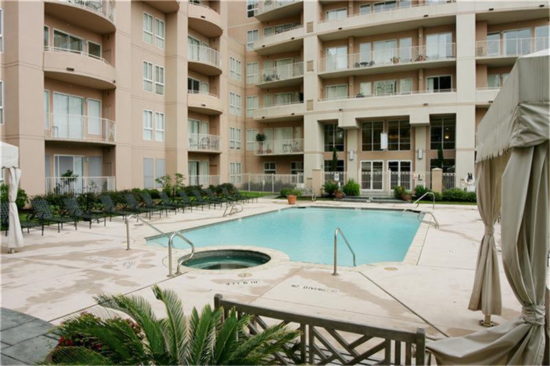 3505 Sage Road, Unit 2403 Houston, TX 77056 - Photo 5 of 26 a view of a building with a swimming pool