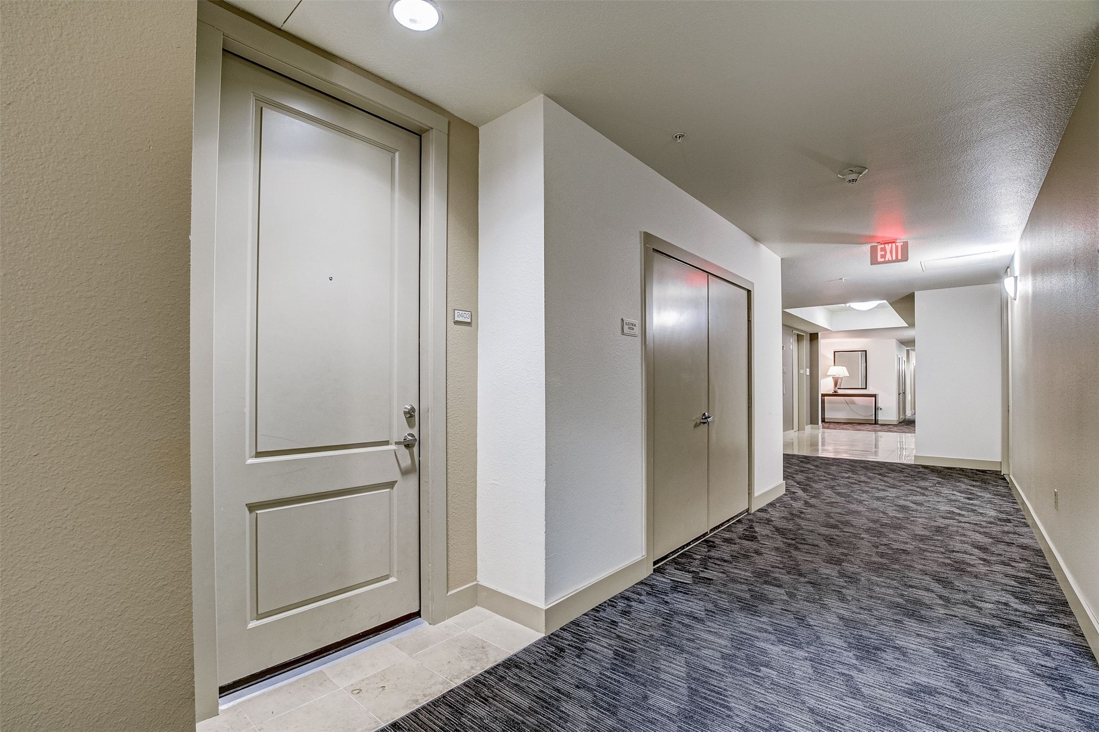 3505 Sage Road, Unit 2403 Houston, TX 77056 - Photo 7 of 26 a view of a hallway with closet and wooden floor