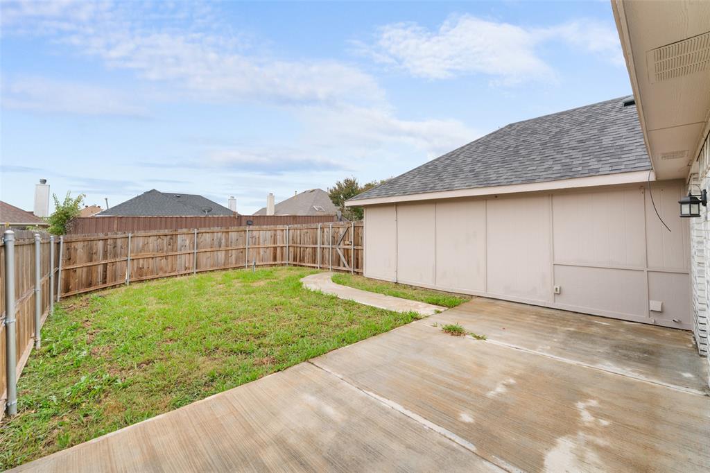 1042 Kim Lane Mesquite, TX 75149 - Photo 14 of 16 a view of a backyard