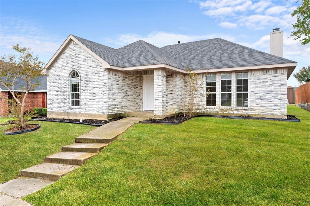 1042 Kim Lane Mesquite, TX 75149 - Photo 16 of 16 a front view of a house with a yard
