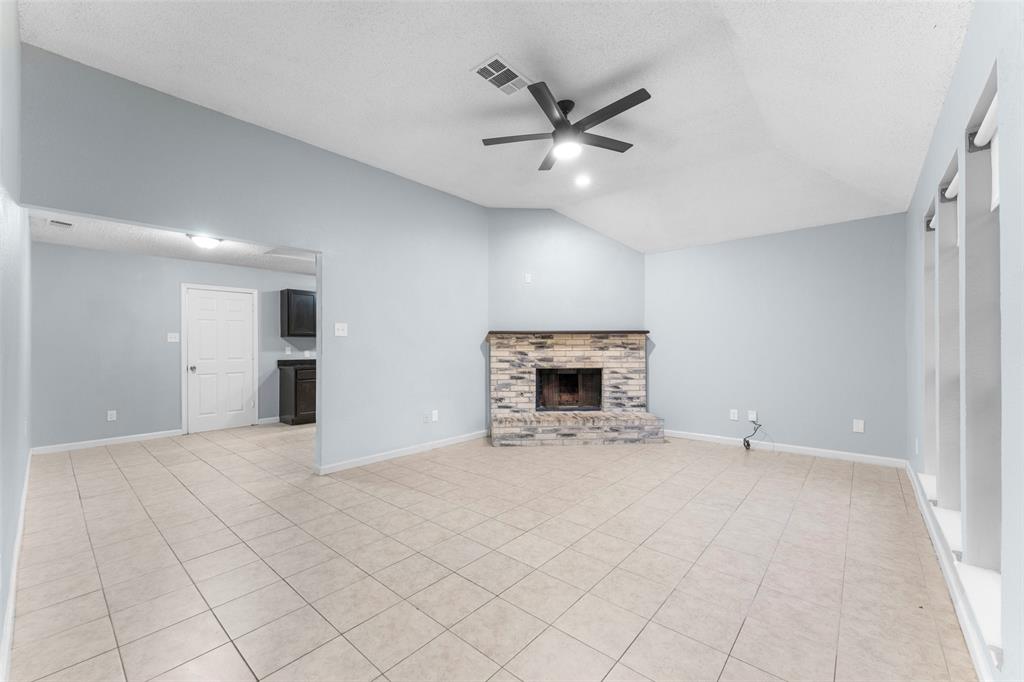 1042 Kim Lane Mesquite, TX 75149 - Photo 2 of 16 a view of an empty room with a fireplace