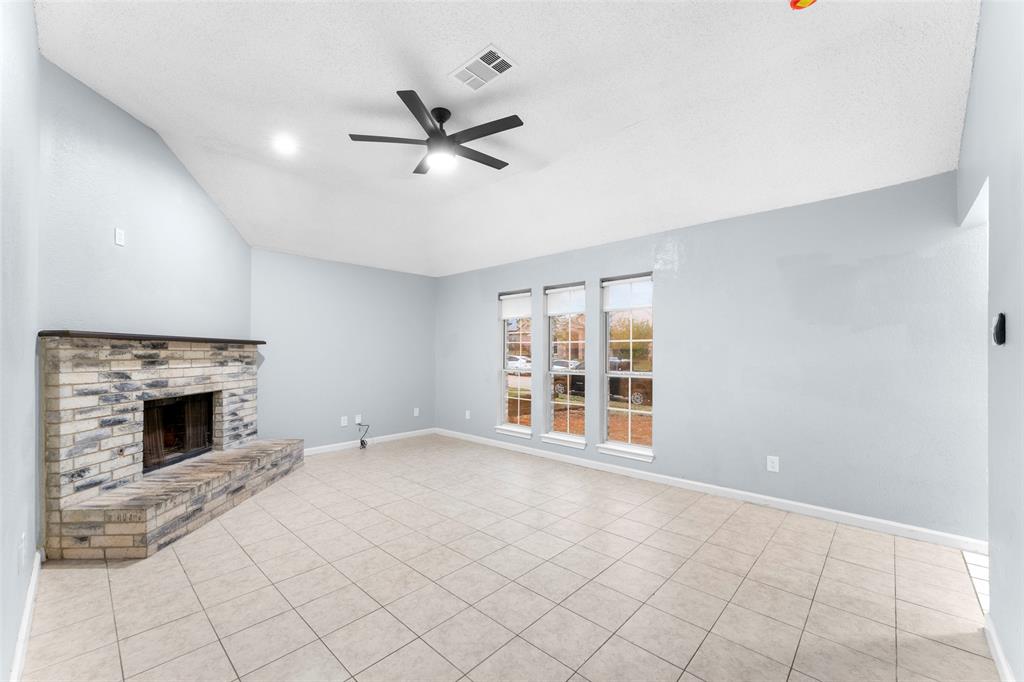 1042 Kim Lane Mesquite, TX 75149 - Photo 3 of 16 a view of an empty room with a fireplace and a window