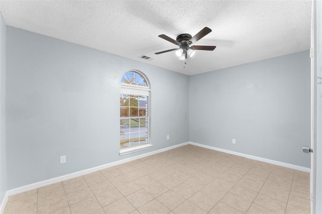 1042 Kim Lane Mesquite, TX 75149 - Photo 10 of 16 a view of an empty room with a window