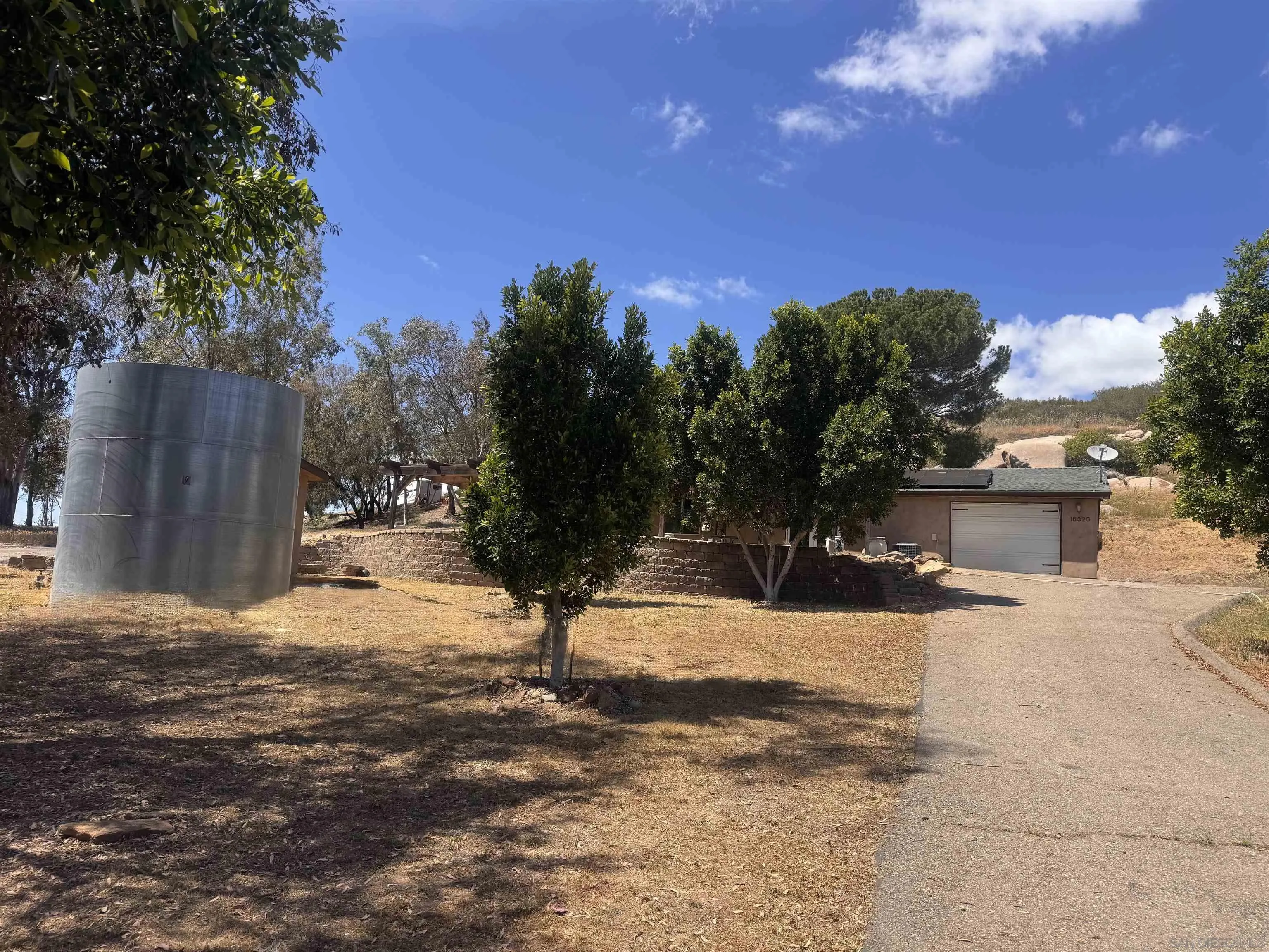 16320 Ellie Lane Poway, CA 92064 - Photo 23 of 56 a view of a yard with snow on the road
