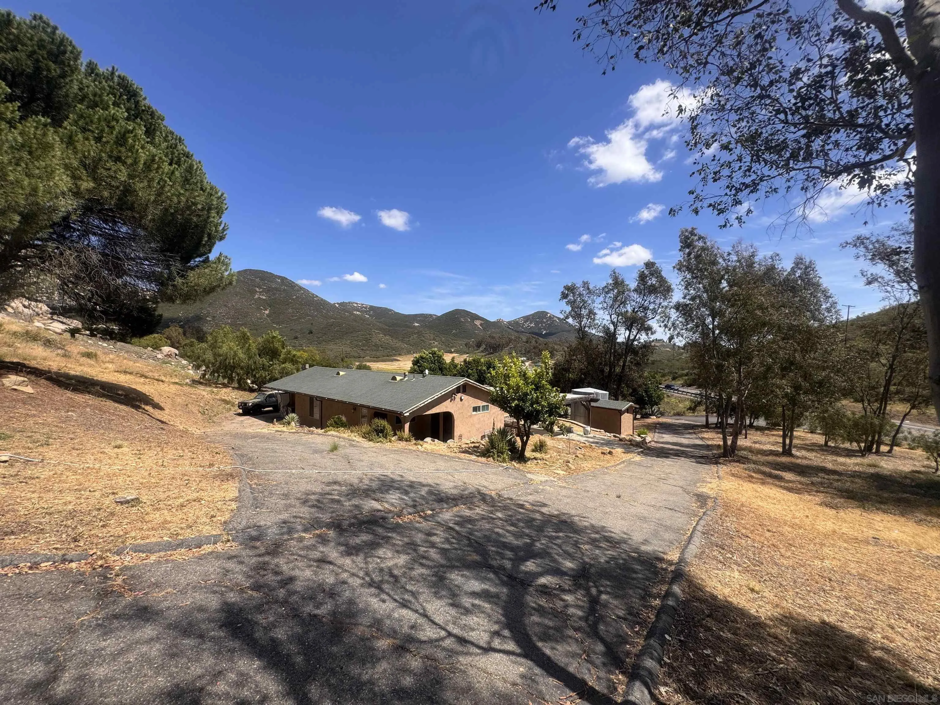 16320 Ellie Lane Poway, CA 92064 - Photo 35 of 56 a view of a road with a building in the background