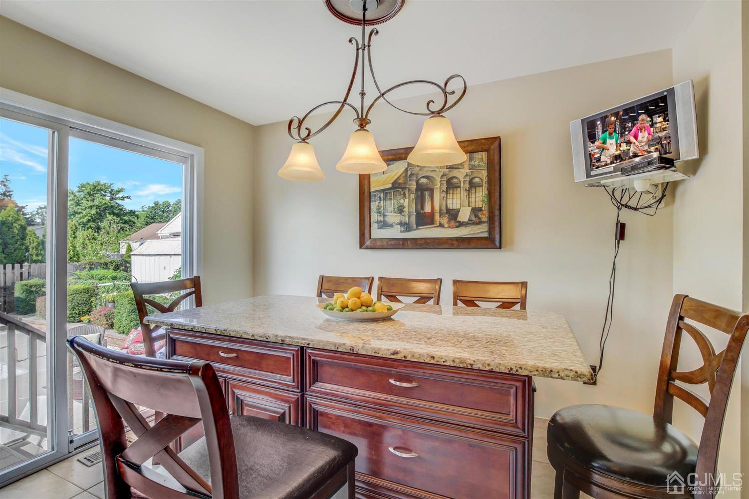 7 Park Place Helmetta, NJ 08828 - Photo 11 of 33 a view of a dining room with furniture a chandelier and wooden floor