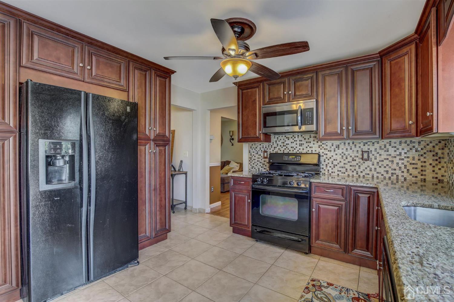 7 Park Place Helmetta, NJ 08828 - Photo 14 of 33 a kitchen with stainless steel appliances granite countertop a refrigerator a stove and a sink