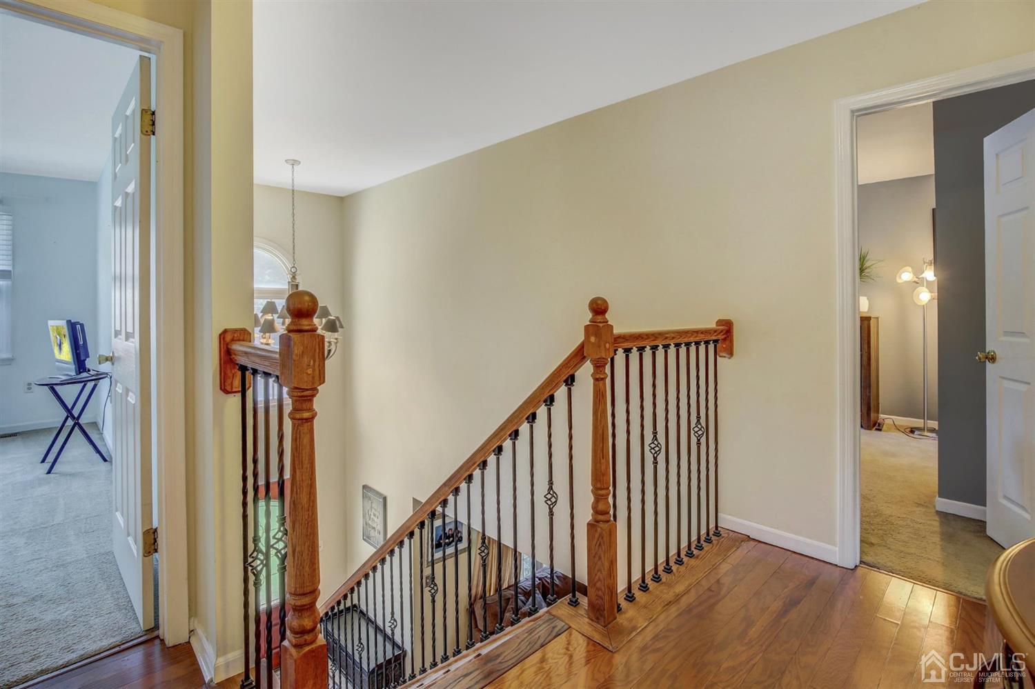 7 Park Place Helmetta, NJ 08828 - Photo 18 of 33 a view of a hallway with wooden floor and stairs