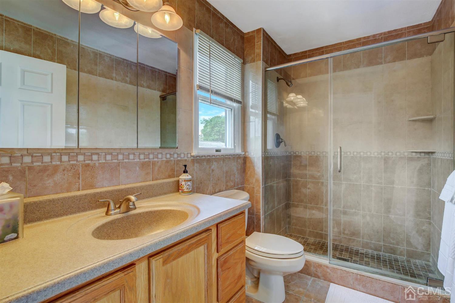 7 Park Place Helmetta, NJ 08828 - Photo 21 of 33 a bathroom with a sink toilet and shower