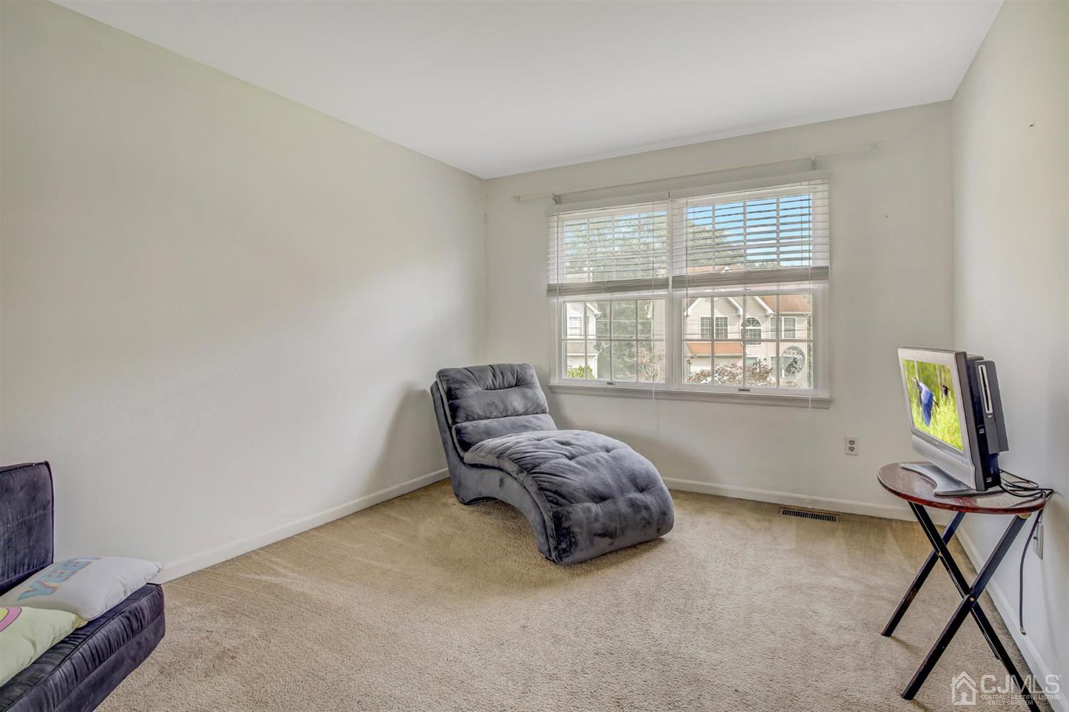 7 Park Place Helmetta, NJ 08828 - Photo 22 of 33 a living room with furniture and a window