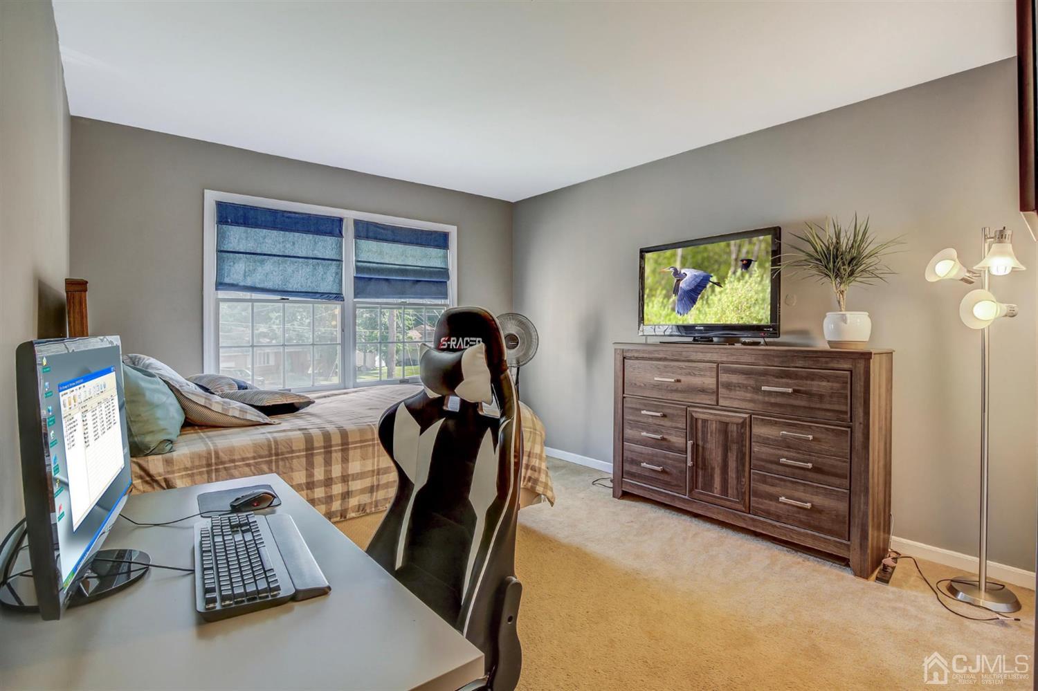 7 Park Place Helmetta, NJ 08828 - Photo 24 of 33 a view of a workspace with furniture and a flat screen tv