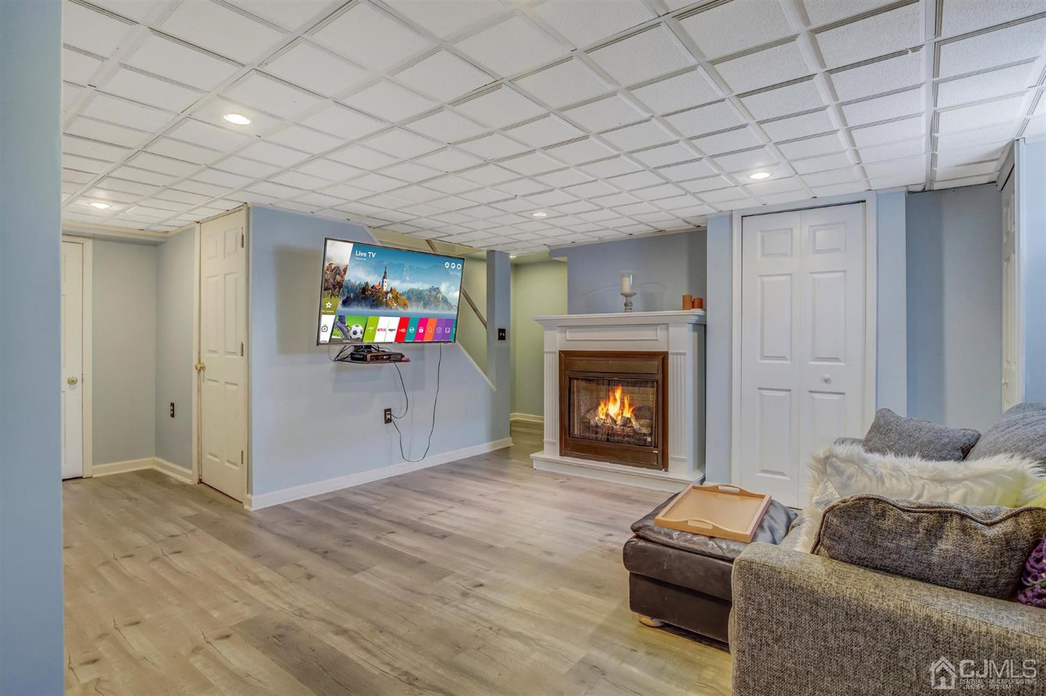 7 Park Place Helmetta, NJ 08828 - Photo 25 of 33 a living room with furniture and a fireplace