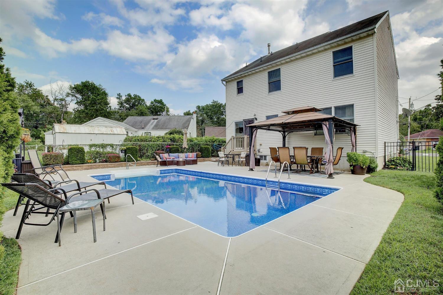 7 Park Place Helmetta, NJ 08828 - Photo 27 of 33 a view of a house with swimming pool and sitting area