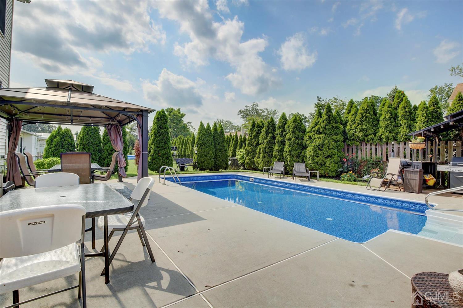 7 Park Place Helmetta, NJ 08828 - Photo 28 of 33 a view of a patio with swimming pool having outdoor seating