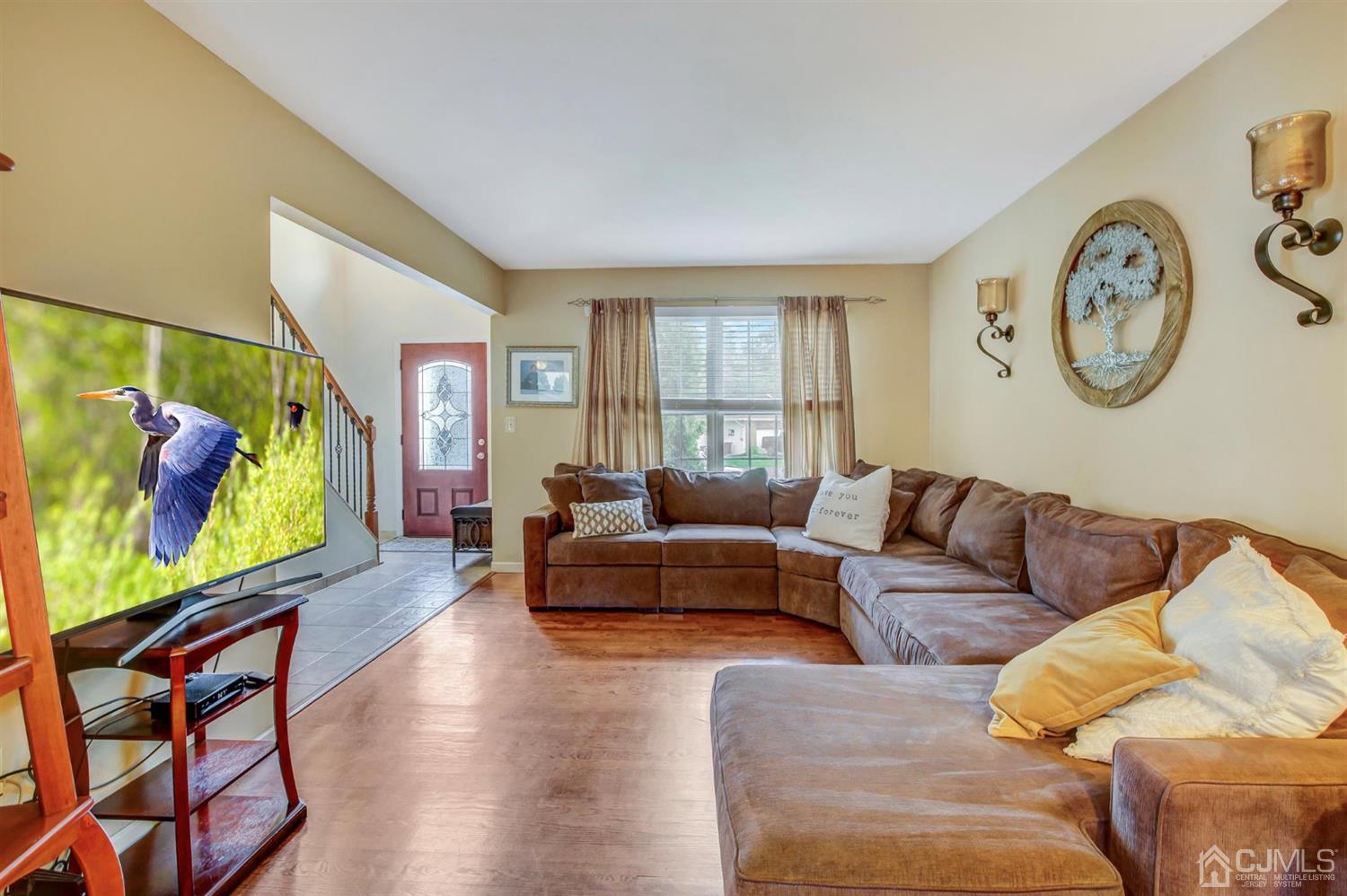 7 Park Place Helmetta, NJ 08828 - Photo 5 of 33 a living room with furniture a rug and a window