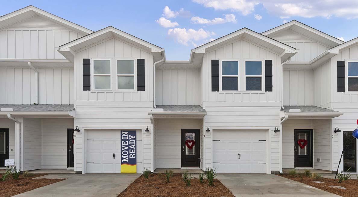 11 Redbird Loop Destin, FL 32541 - Photo 1 of 30 a front view of a house with a yard