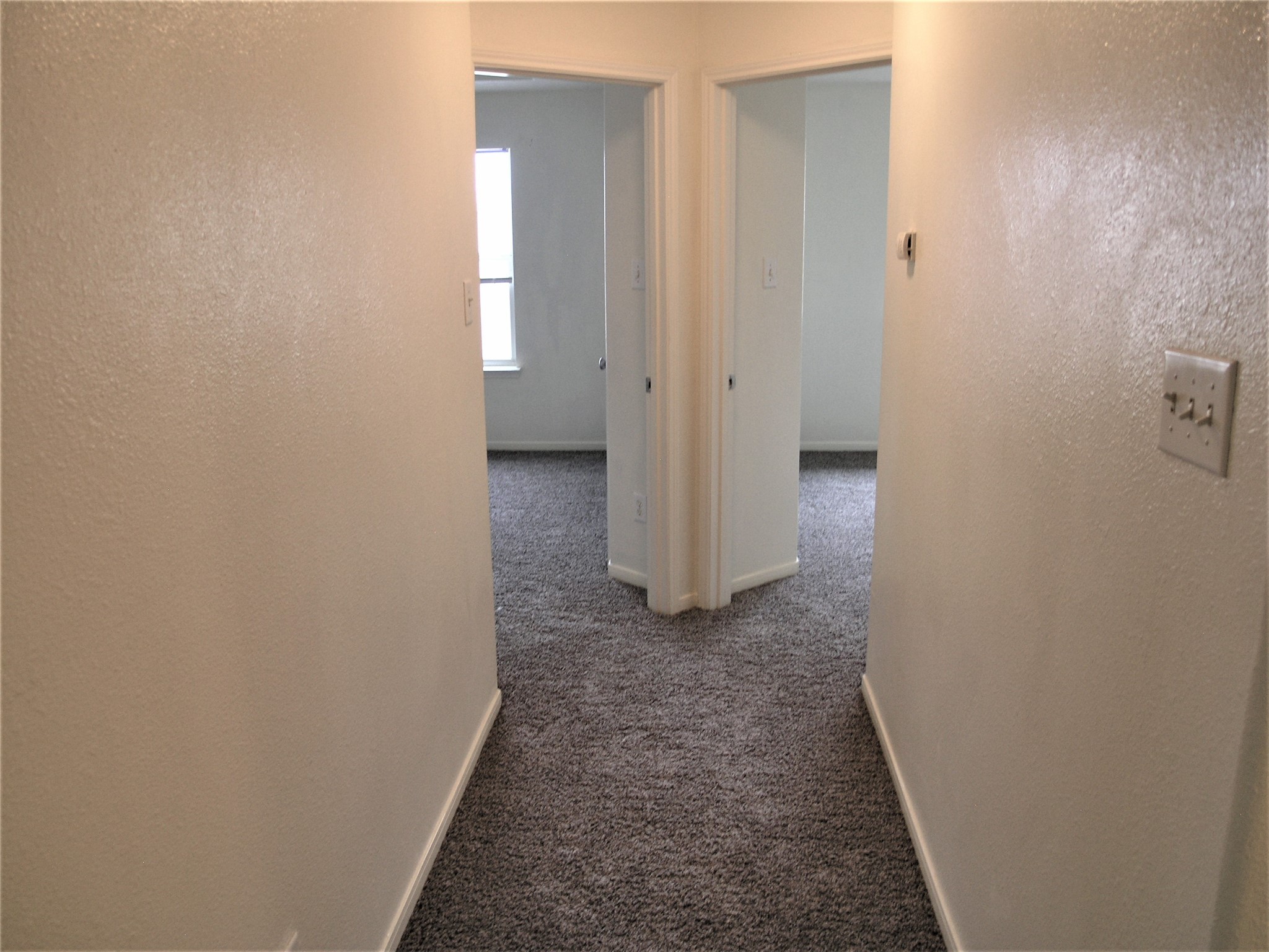 2926 Meadowglen Crest Houston, TX 77082 - Photo 13 of 22 Hall to Primary Bedroom and 3rd Bedroom