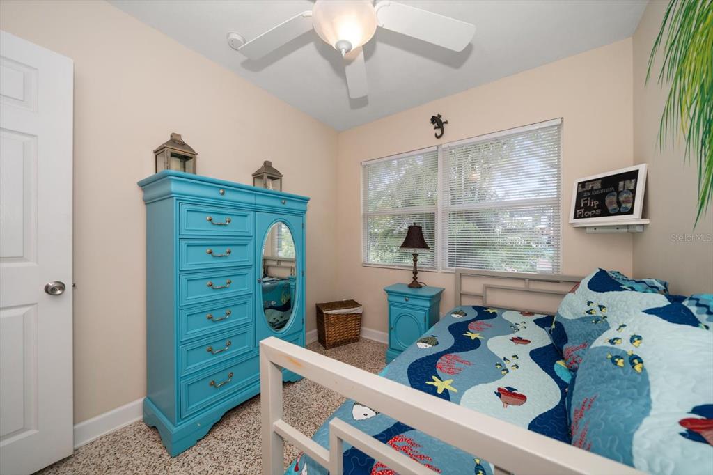 301 Cevera Road Dunedin, FL 34698 - Photo 15 of 33 a bed room with a bed and a window