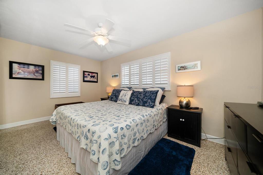 301 Cevera Road Dunedin, FL 34698 - Photo 17 of 33 a bedroom with a bed and a night stand