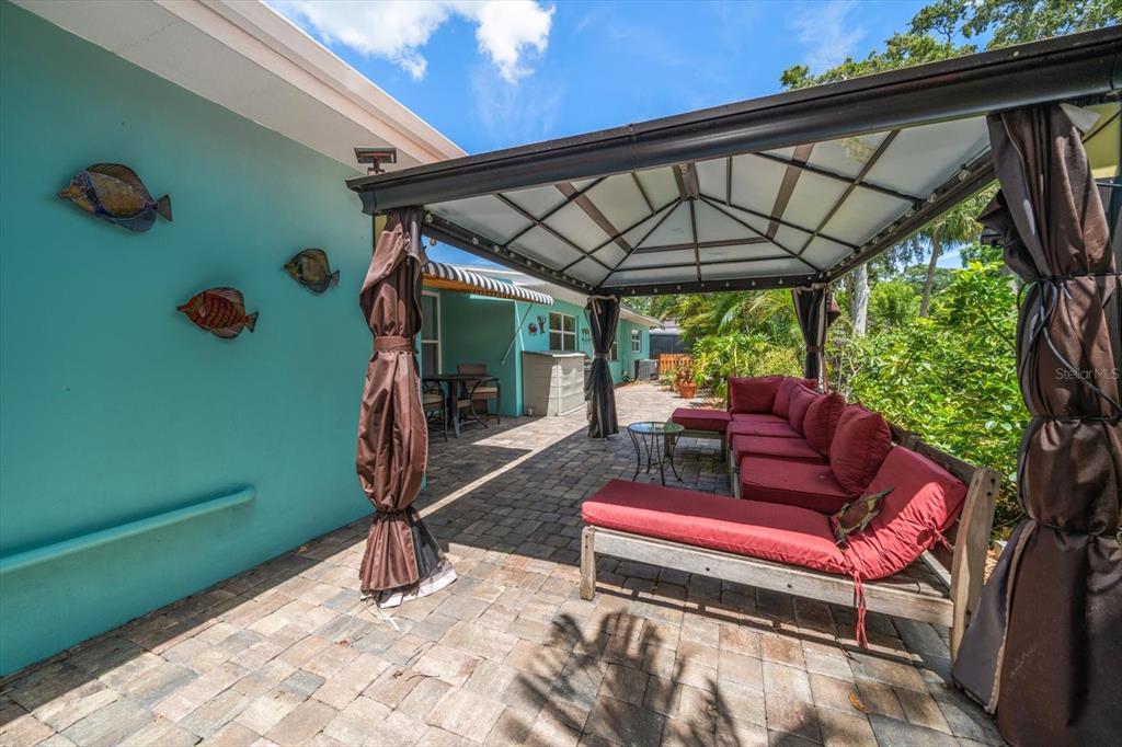 301 Cevera Road Dunedin, FL 34698 - Photo 28 of 33 a view of a chairs and couches in the patio