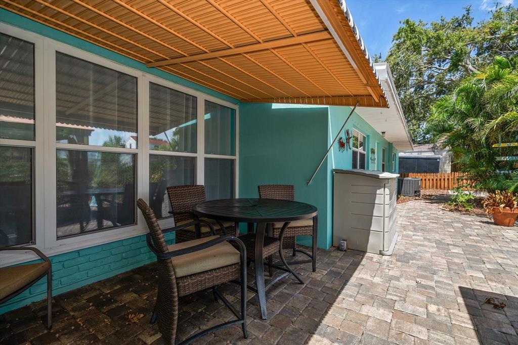 301 Cevera Road Dunedin, FL 34698 - Photo 29 of 33 a backyard of a house with table and chairs