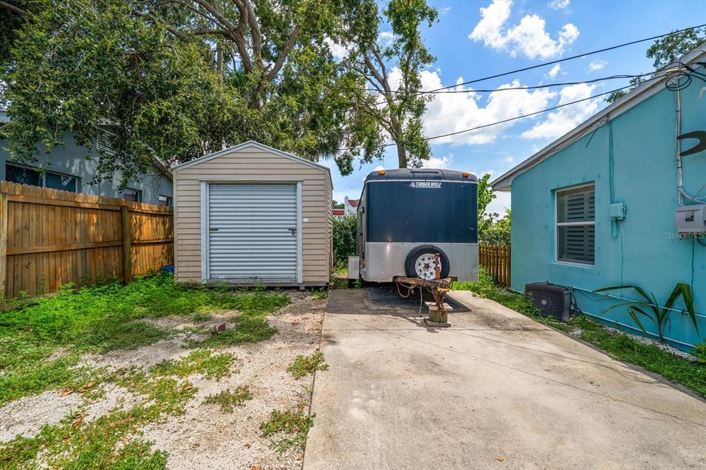 301 Cevera Road Dunedin, FL 34698 - Photo 32 of 33 a view of backyard with a patio and a garden