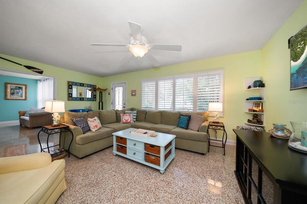301 Cevera Road Dunedin, FL 34698 - Photo 6 of 33 a living room with furniture and a large window