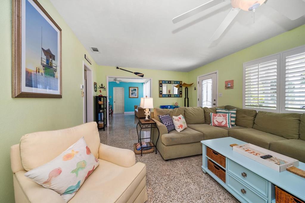 301 Cevera Road Dunedin, FL 34698 - Photo 7 of 33 a living room with furniture and a window