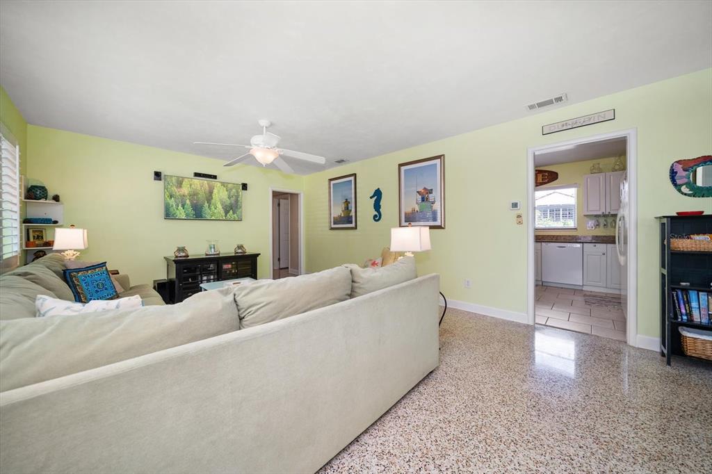 301 Cevera Road Dunedin, FL 34698 - Photo 9 of 33 a living room with furniture and a flat screen tv