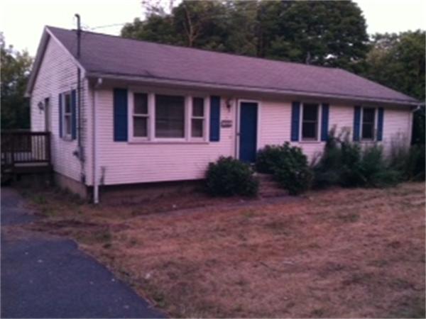 68 Wood Hill Road Monson, MA 01057 - Photo 1 of 3 a front view of a house with garden
