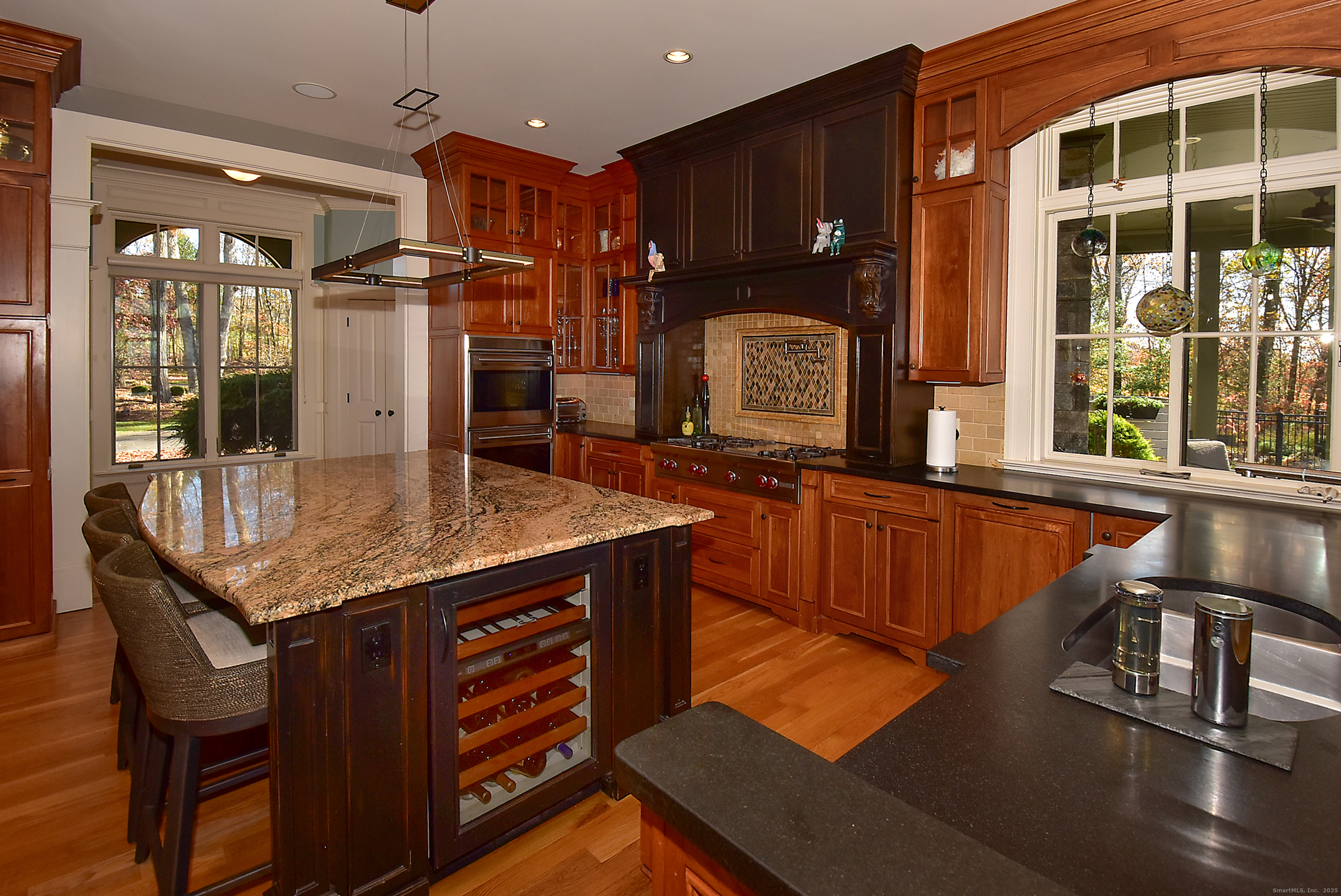 6 Setting Sun Trail Ellington, CT 06029 - Photo 12 of 40 a kitchen with stainless steel appliances granite countertop a stove a sink and a refrigerator
