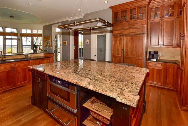 a kitchen with sink and refrigerator