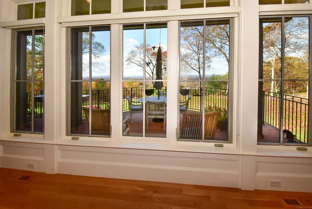 a view of a window of a house with a swimming pool