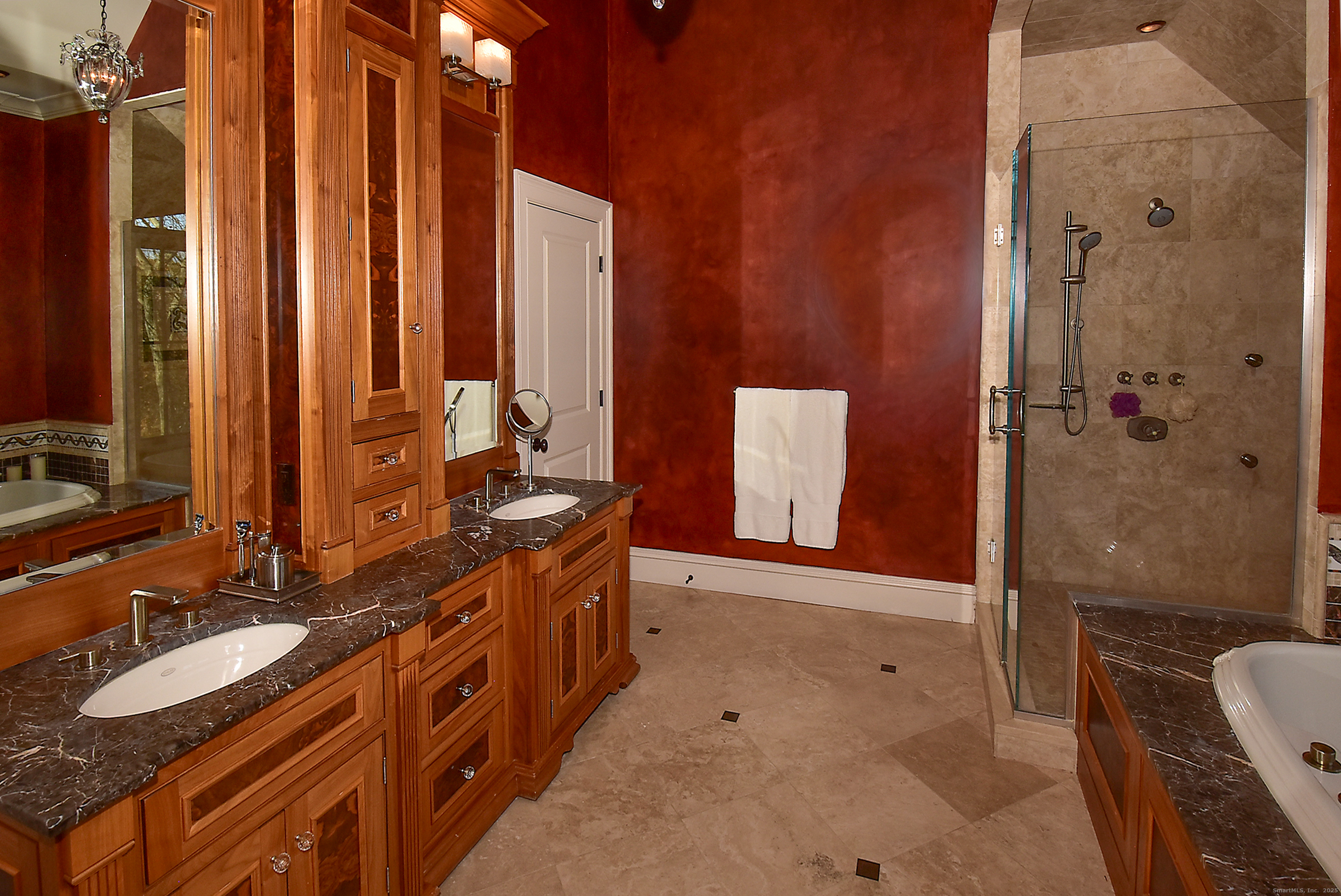 6 Setting Sun Trail Ellington, CT 06029 - Photo 27 of 40 a bathroom with a double vanity sink a toilet a mirror and shower