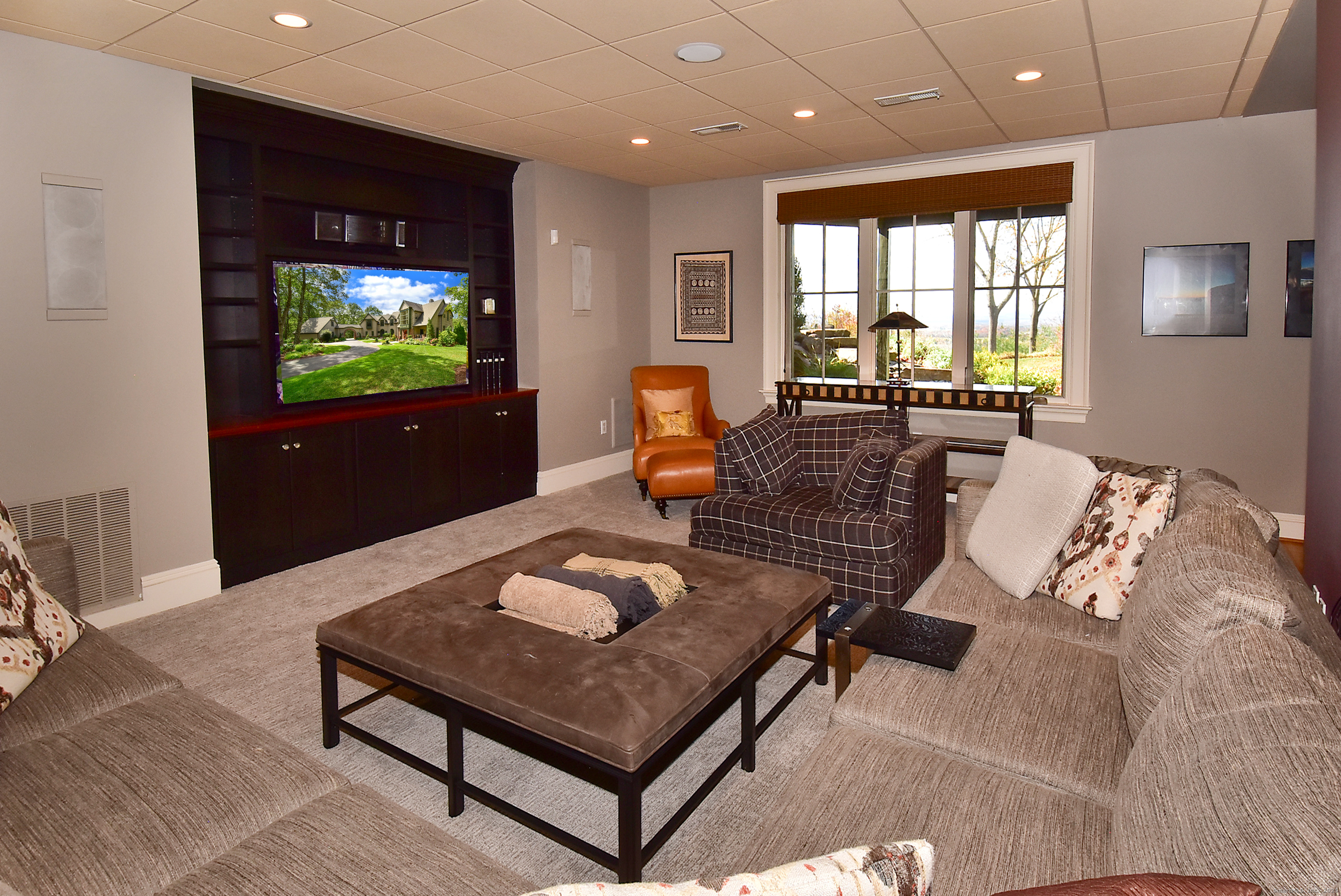 6 Setting Sun Trail Ellington, CT 06029 - Photo 39 of 40 a living room with furniture a flat screen tv and floor to ceiling window