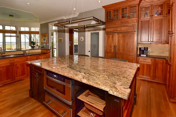 a kitchen with sink and refrigerator